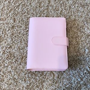 personal size pink planner with goodies